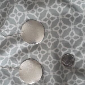 Silver disk dangling earrings by Apt 9